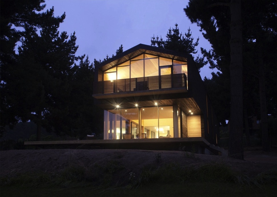 wooden-hilltop-house-sleeps-fourteen-people-4-front-edge-night.jpg
