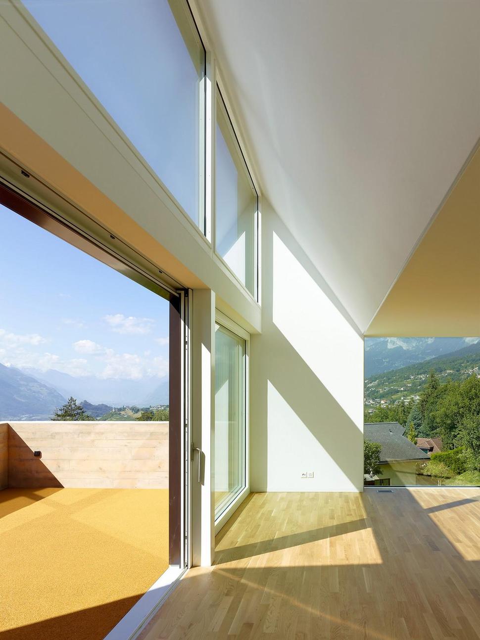 hillside-house-with-wood-look-concrete-covering-20-open-deck-door.jpg