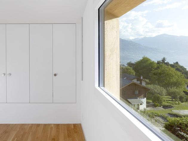 hillside-house-with-wood-look-concrete-covering-23-bedroom-storage.jpg
