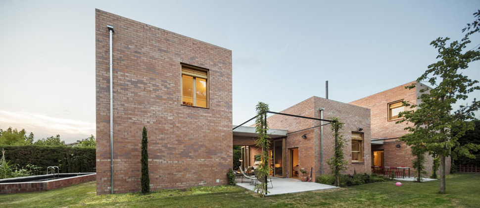 house-of-three-brick-boxes-and-outdoor-living-rooms-between-16.jpg