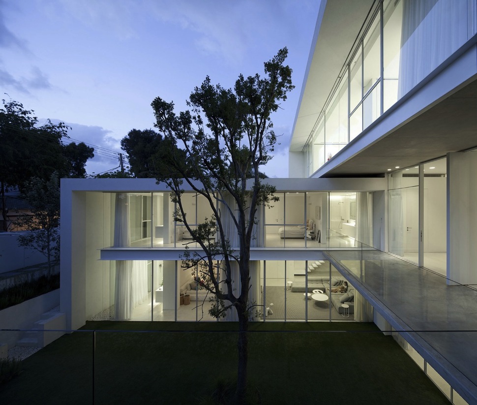 minimal-house-with-hangar-style-rear-facade-6-front-deck-evening.jpg