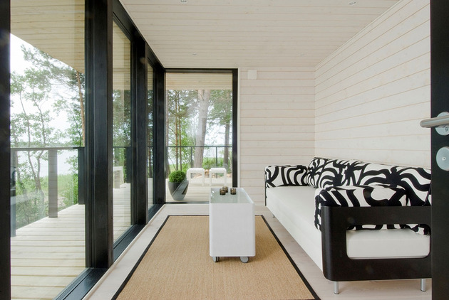 modern-wooden-vacation-house-built-on-rocks-6-sitting-room.jpg