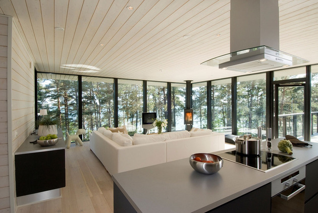 modern-wooden-vacation-house-built-on-rocks-7-kitchen-living-room.jpg