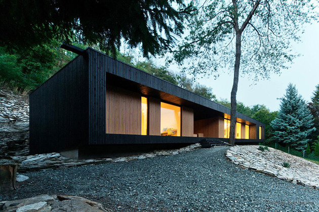 timber-cabin-built-into-cliff-side-site-16.jpg