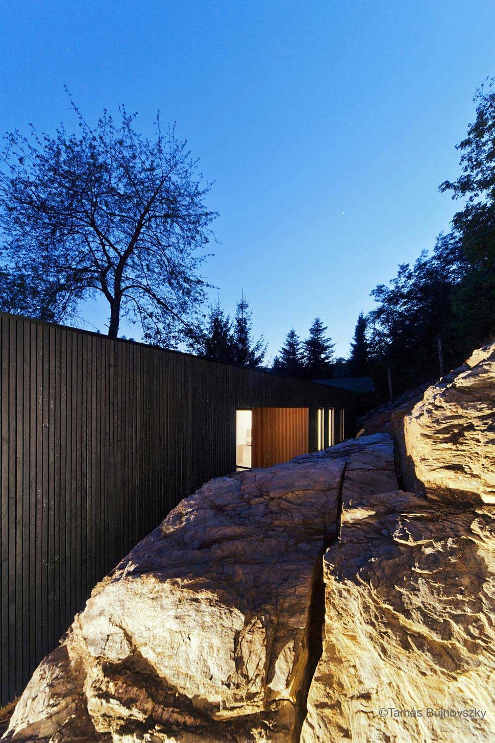 timber-cabin-built-into-cliff-side-site-18.jpg