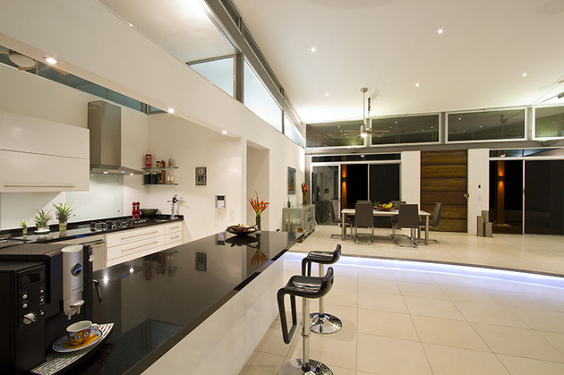 2-adjustable-eaves-create-thermal-comfort-glass-house-7-kitchen.jpg
