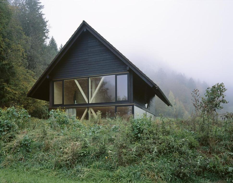 barn-home-floats-round-window-over-lower-facade-glass-6-exterior.jpg