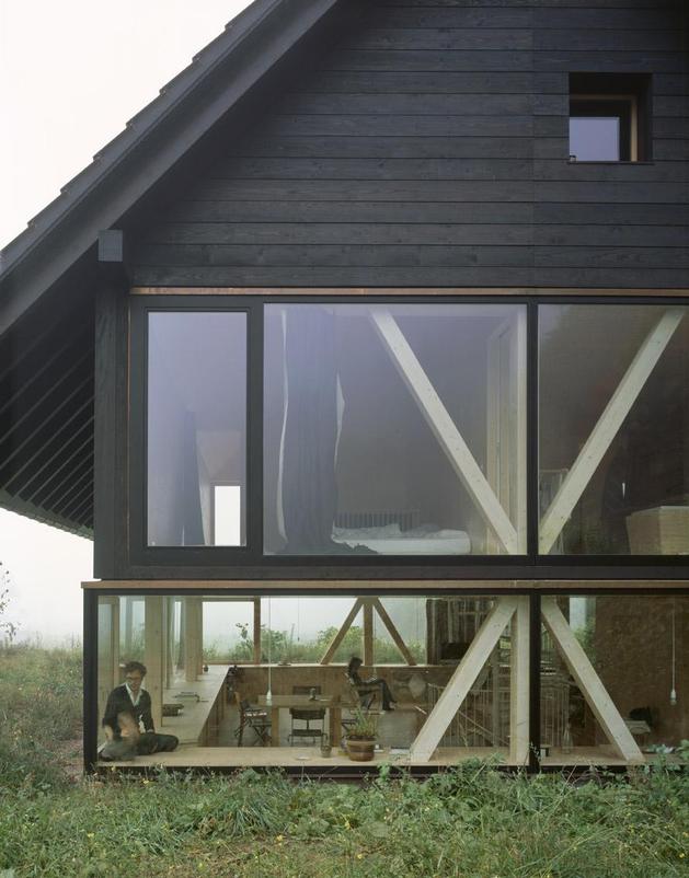 barn-home-floats-round-window-over-lower-facade-glass-9-exterior.jpg