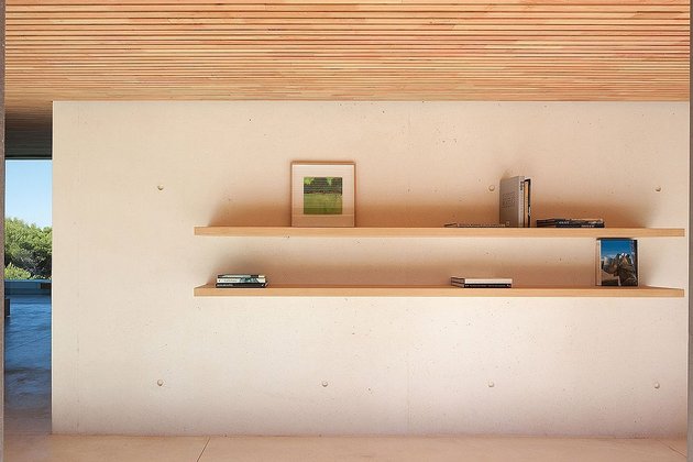 concrete-glass-home-main-level-wood-ceiling-5-shelves.jpg