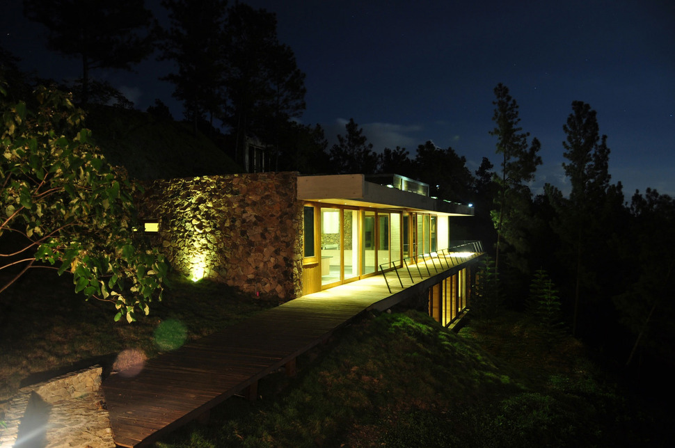 grass-roofed-home-built-slope-hillside-cooling-24-night.jpg