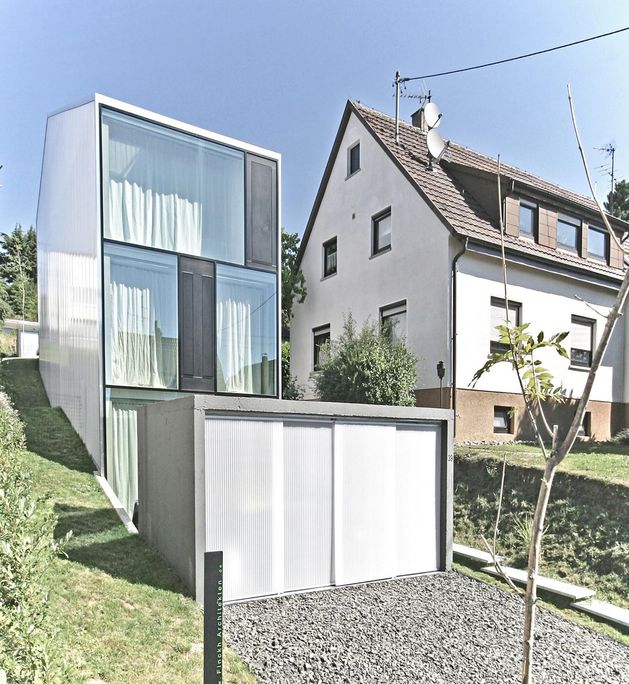 tall-minimalistic-hillside-house-built-from-concrete-1-below.jpg