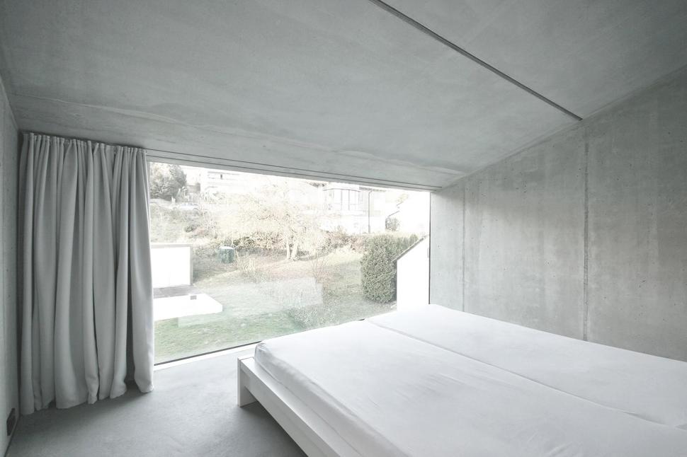 tall-minimalistic-hillside-house-built-from-concrete-14-bedroom.jpg
