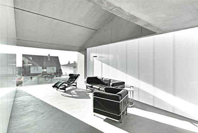 tall-minimalistic-hillside-house-built-from-concrete-7-living-room.jpg