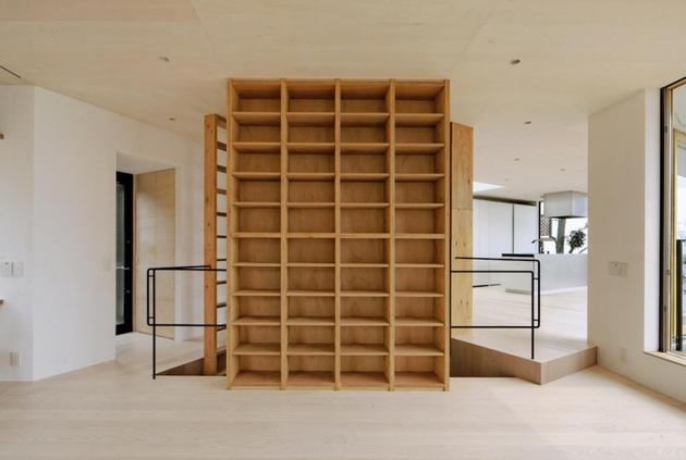 steep-slope-house-with-bookshelf-lined-interior-7-bookshelves-straight.jpg