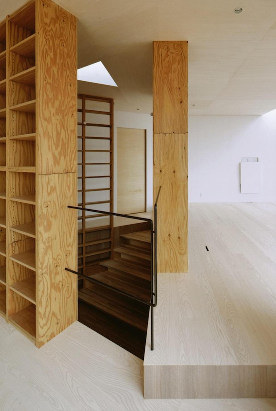 steep-slope-house-with-bookshelf-lined-interior-8-hidden-stairs.jpg