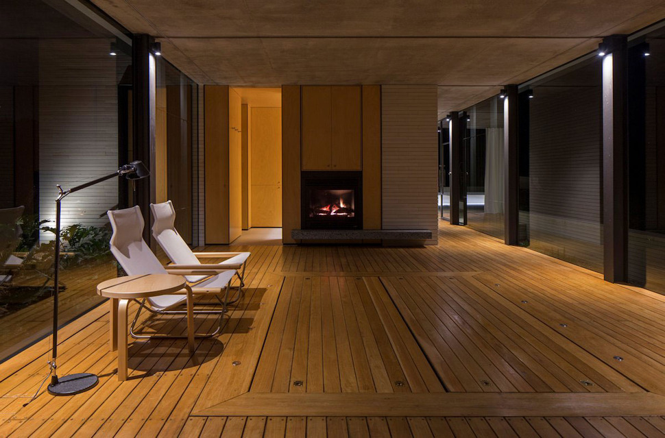 romantic-guest-house-cantilevers-spa-over-lilly-pond-15-fireplace.jpg