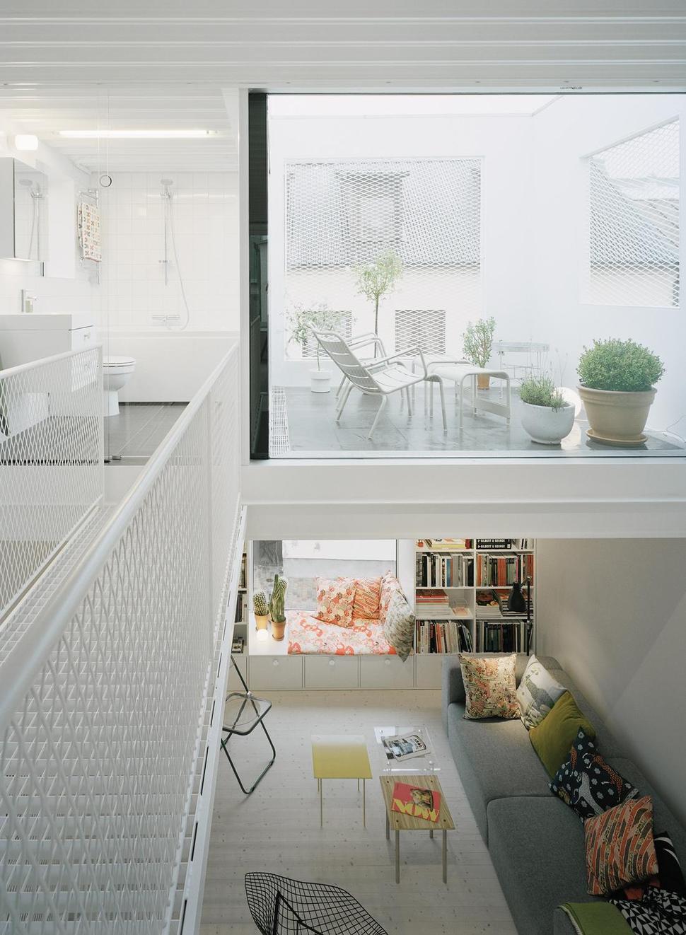 white-townhouse-with-open-interiors-detached-office-11-bridge-deck.jpg