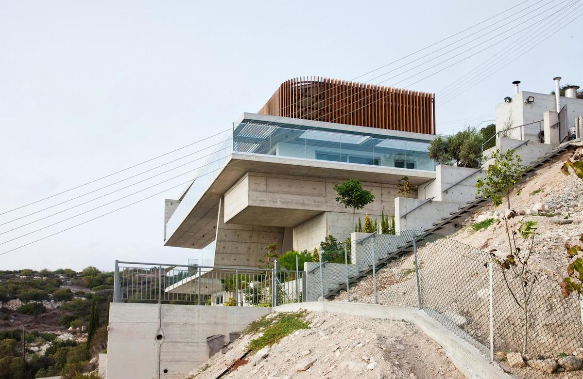 slope-home-steps-down-street-level-rooftop-garage-5.jpg