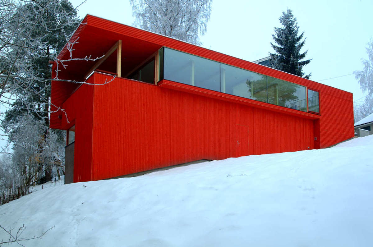 red-house-exteriors-paint-the-town-home-in-the-snow.jpg
