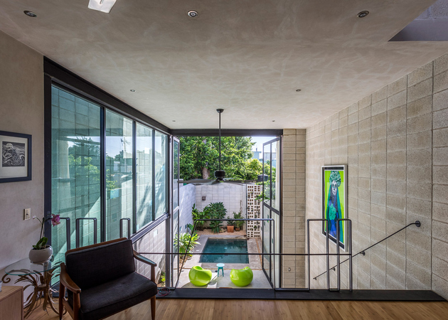 9-skinny-concrete-home-double-height-glass-doors.jpg