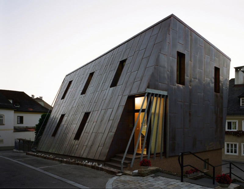 austrian house with copper exterior and slanted shape 12
