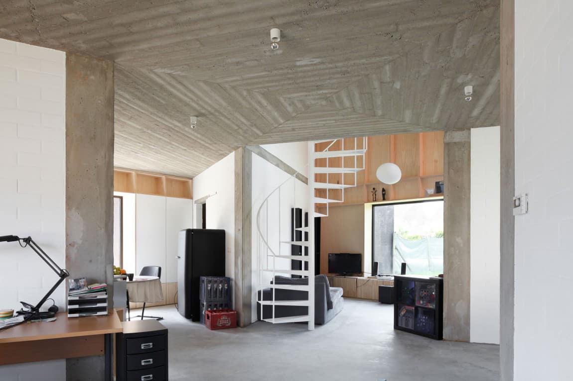 Belgium Angle House with Concrete, Wood and Brick Interiors