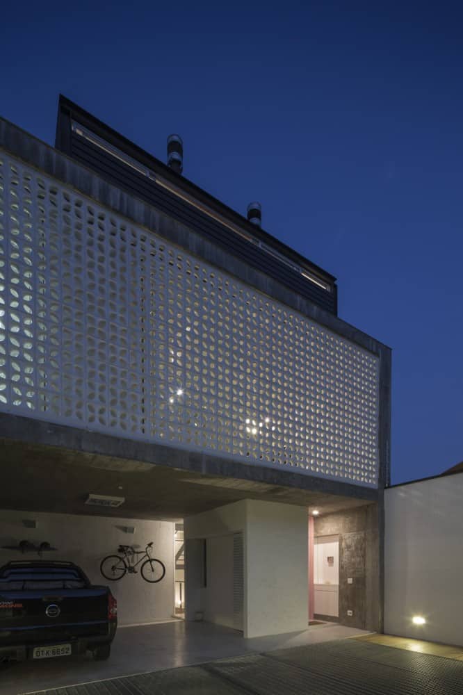brazilian concrete house built around three story courtyard tree 3 garage facade pattern