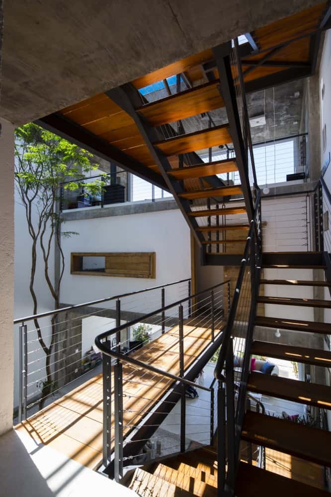 brazilian-concrete-house-built-around-three-story-courtyard-tree-5-second-level-stairs.jpg