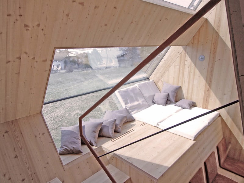 compact-irregularly-shaped-austrian-mountain-house-on-stilts-13-window-from-above.jpeg