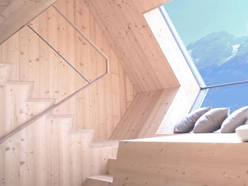 compact-irregularly-shaped-austrian-mountain-house-on-stilts-14-stairs.jpg