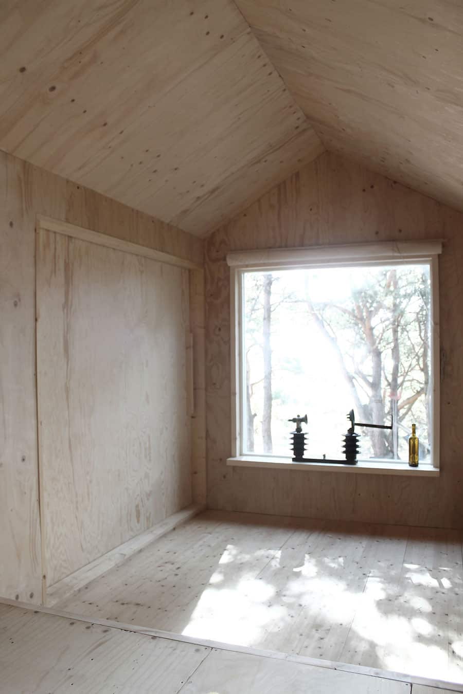 compact plywood pine cabin with attached sauna 7 living room closed