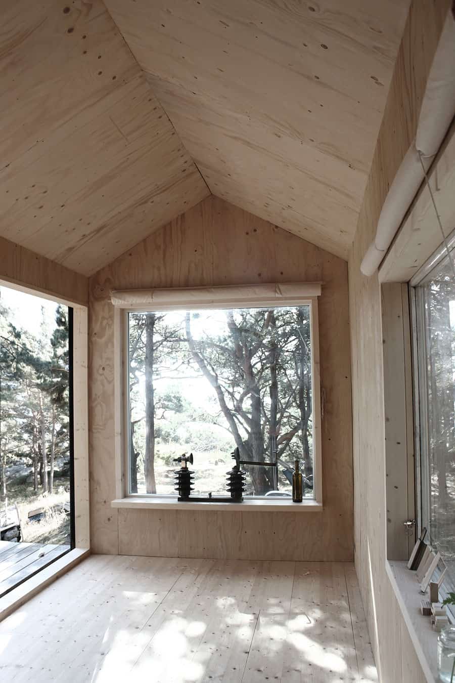 compact plywood pine cabin with attached sauna 9 three windows