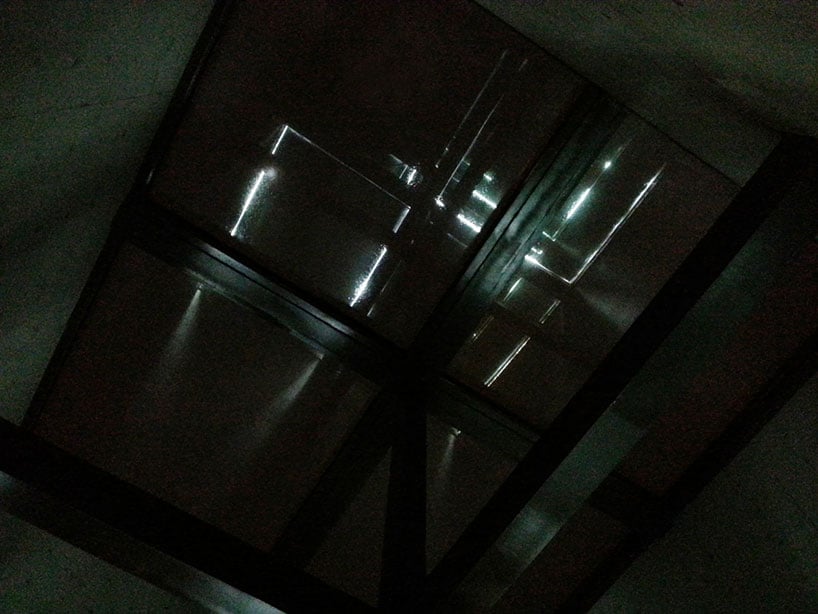 concrete tower house with see through floors 8 night