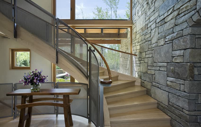 contemporary stone farmhouse with aged wood siding segments 9 staircase