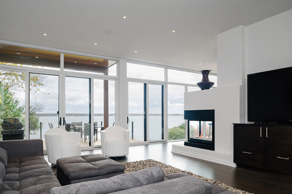contemporary-style-house-designed-with-glass-walls-riverfront-views-3.jpg