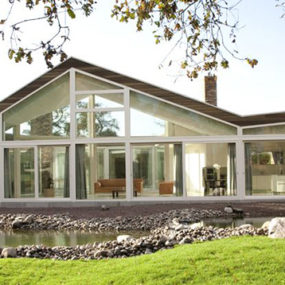 Center Courtyard Home Plans – Timeless Ranch Design with Glass Facade