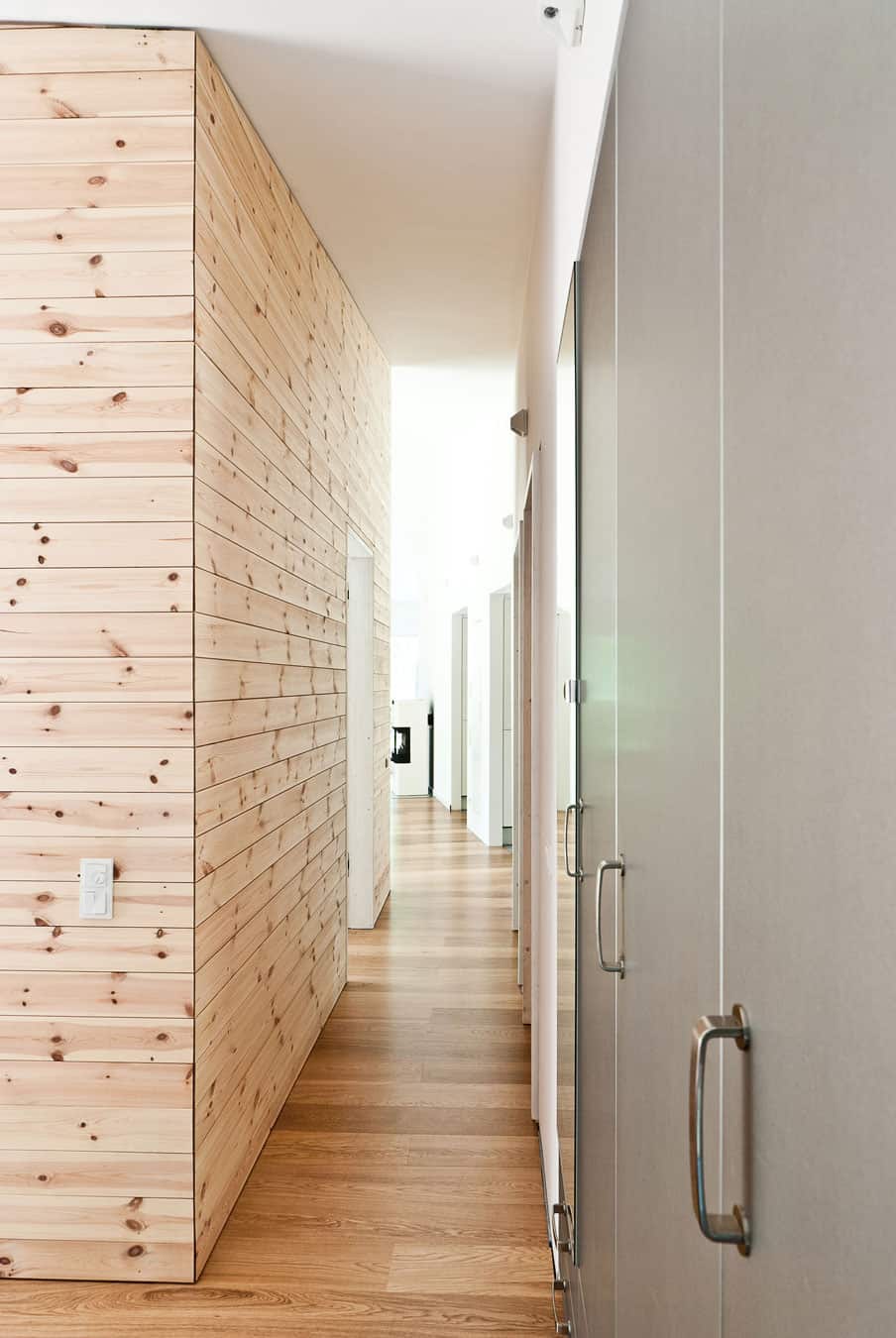 cozy-asymmetrical-home-with-wood-variety-14-hallway-doors.jpg