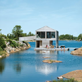 Floating House with an Integrated Boathouse and Dock