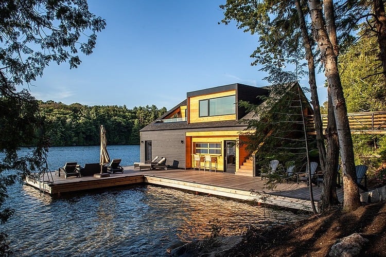 floating-wooden-one-bedroom-cabin-with-integrated-boathouse-3-deck-side.jpg