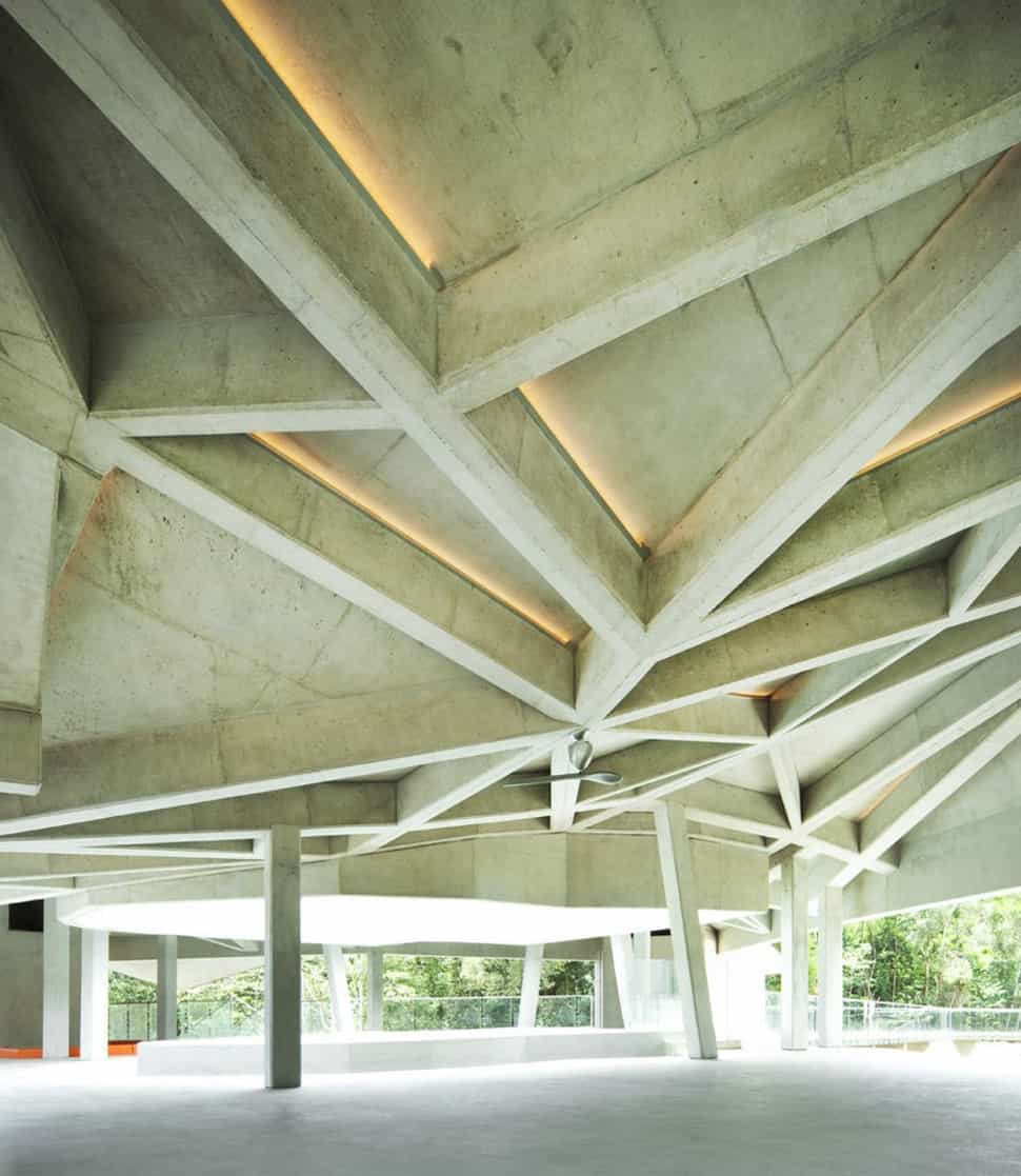 futuristic concrete house with bridge access and eco appeal 6