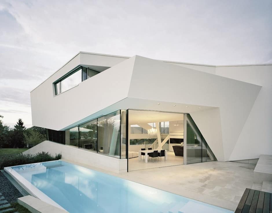 futuristic home with multi faceted shape and minimalist aesthetic 12