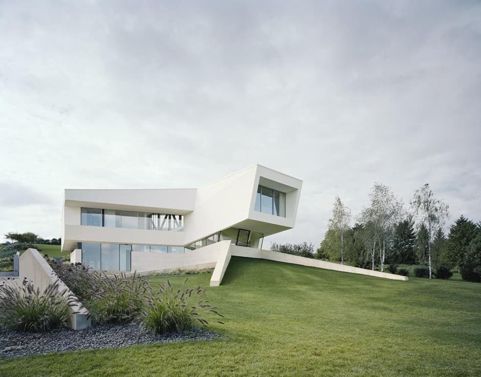 futuristic home with multi faceted shape and minimalist aesthetic 2