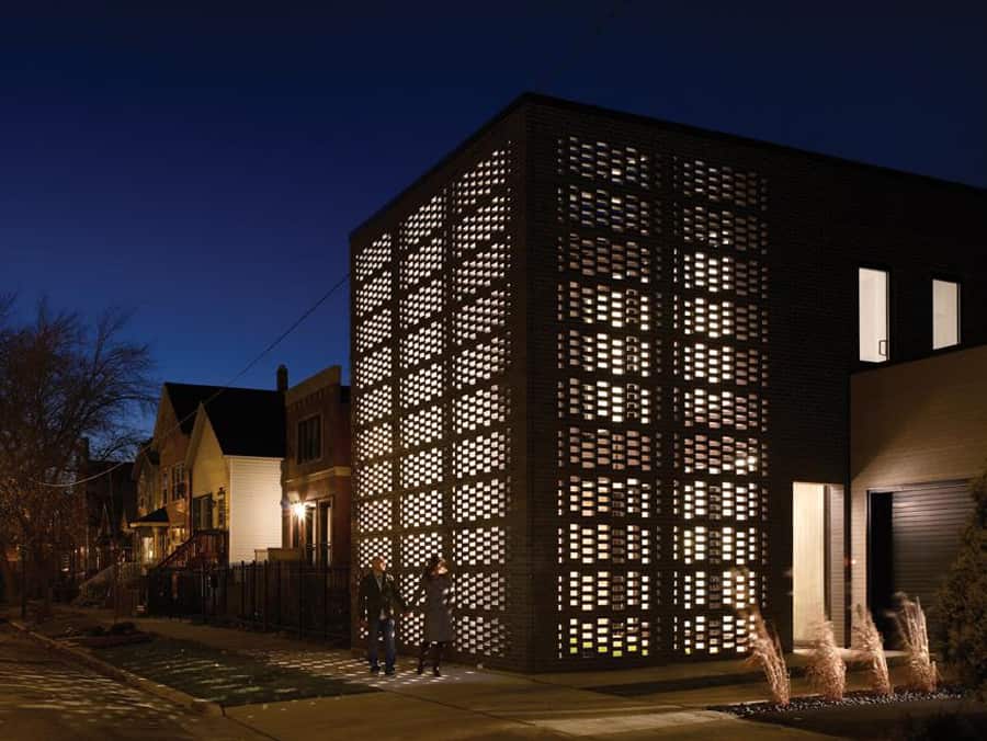 house with woven brick screen enclosing home and garden 1