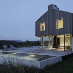 Isolated Swiss Countryside Home With Glass-Encased Lower Floor