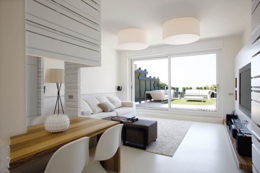 minimalist seafront house with textured interior walls 4
