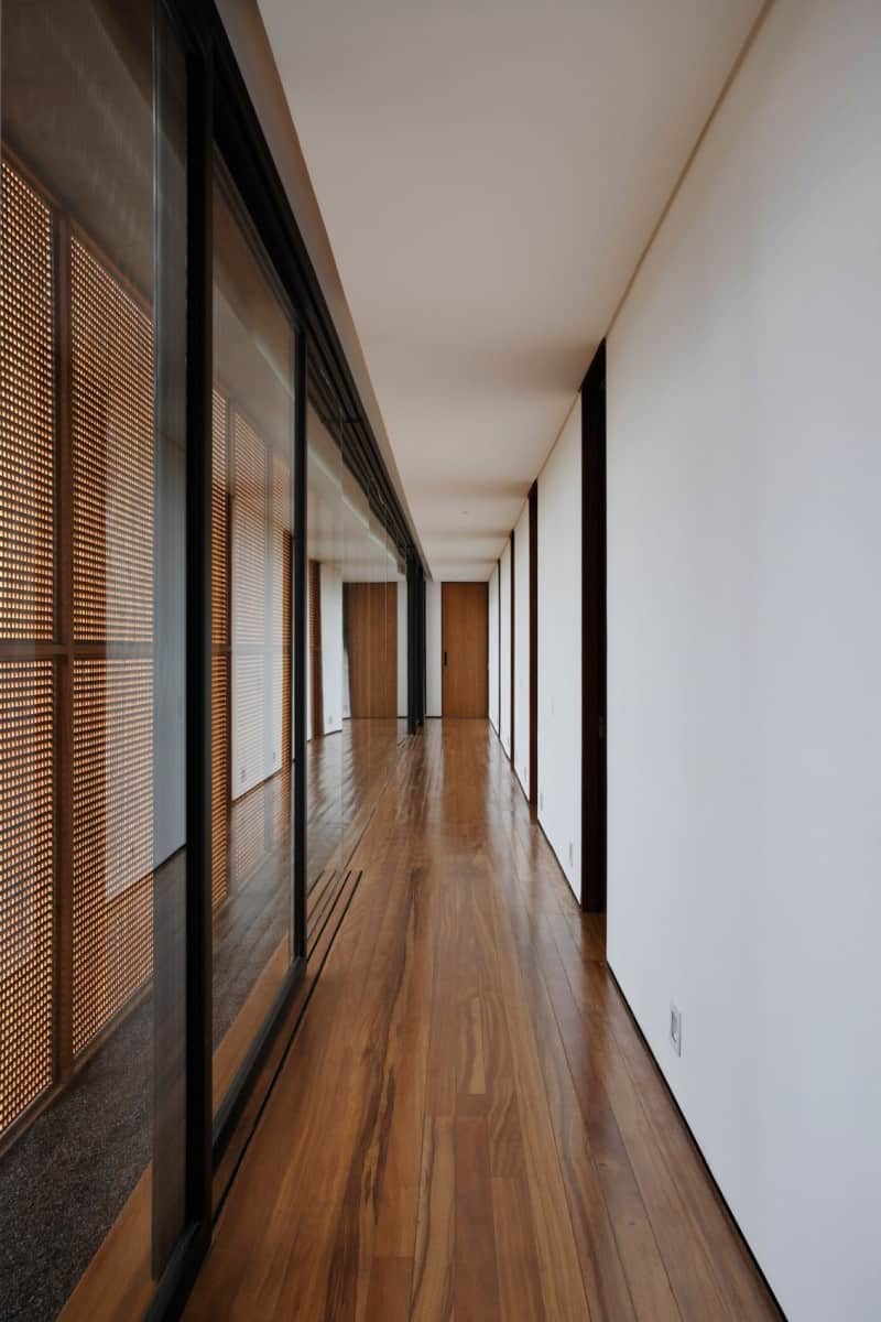 minimally built home striking public private spaces 18 private hallway