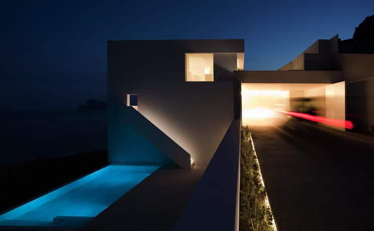 monolithic house suspended above the sea 9