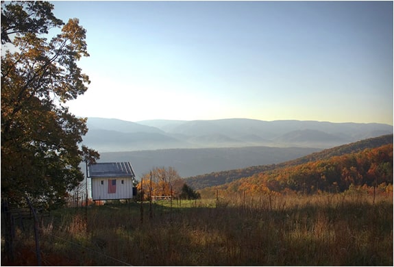 off the grid cabin with glass garage door 3 behind