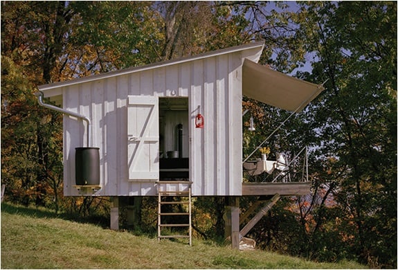off-the-grid-cabin-with-glass-garage-door-4-side.jpg