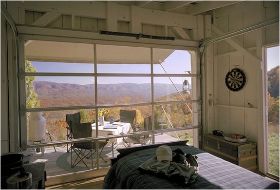 off-the-grid-cabin-with-glass-garage-door-6-view-out.jpg